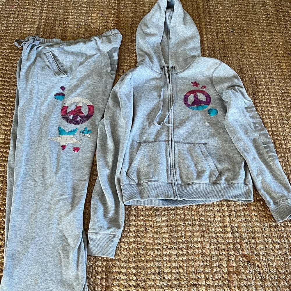 PINK Sweatsuit  by VS, 2 piece With sequined peace sign.
Top M
Bottoms XS